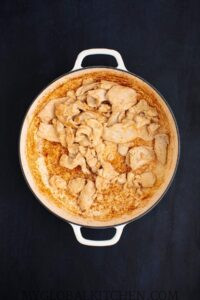 Chicken pieces cooking a pan