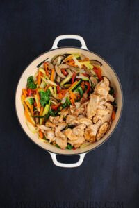 Add the cooked chicken back to the stir-fry pot
